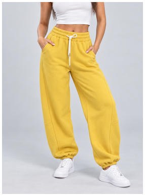 Yellow relaxed joggers styled with a white crop top